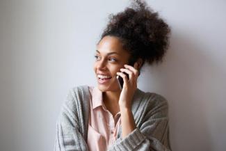 Image of person holding a mobile phone near their ear