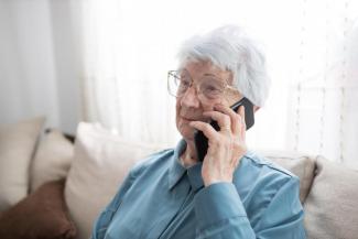 Image of person holding a mobile phone near their ear