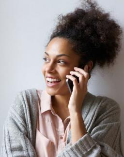 Image of person holding a mobile phone near their ear